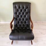 Black leather rocking Chesterfield armchair