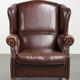 Vintage sheepskin wingback armchair with a timeless English look