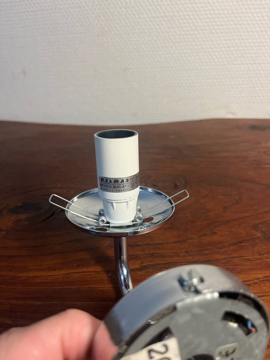 Delmas chrome wall light with chiseled glass globe