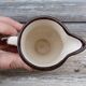 Vintage ceramic milk jug in Breton style, marked Arcachon