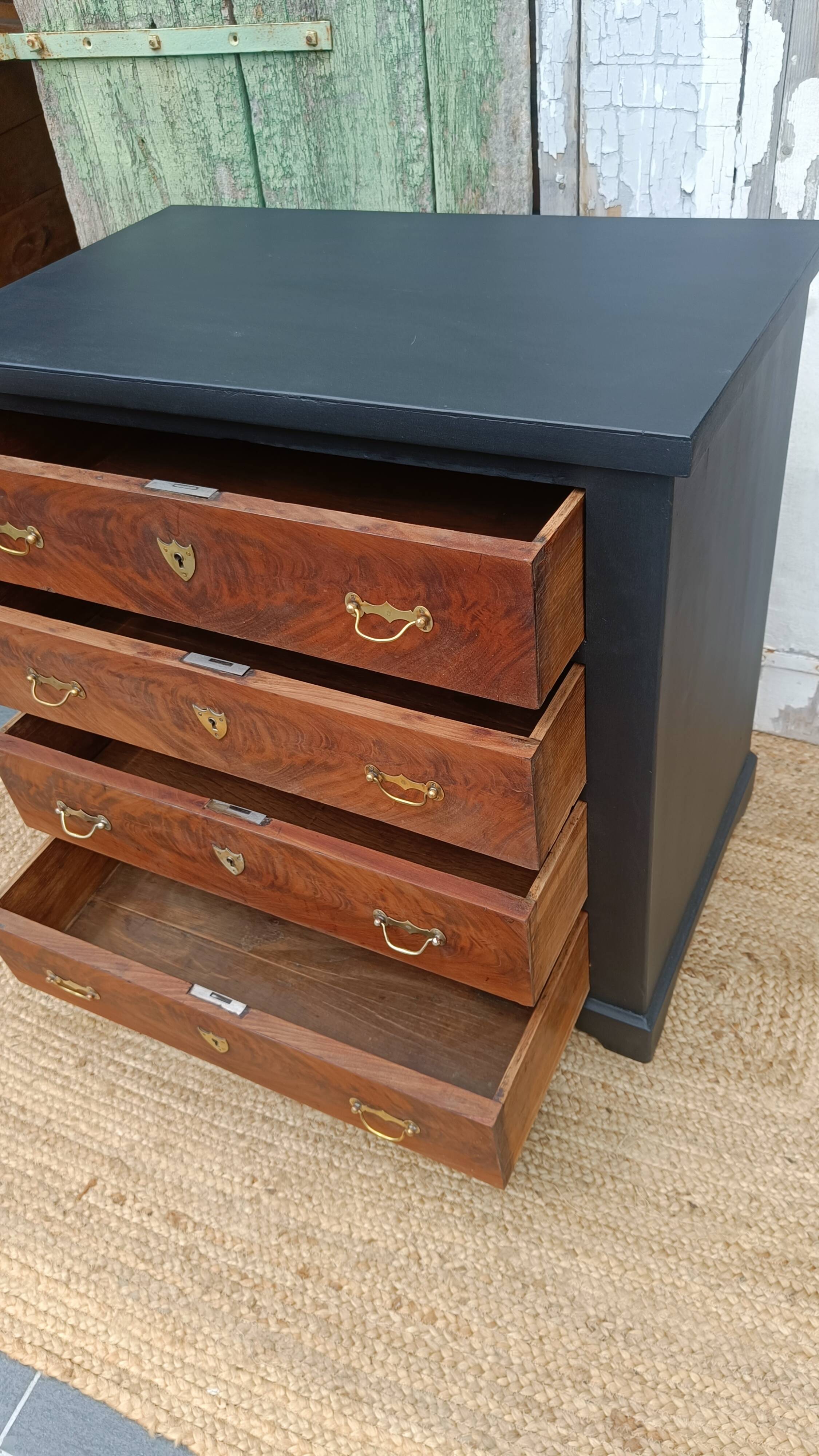 Vintage commode revamped in matte black & wood with warm tones.