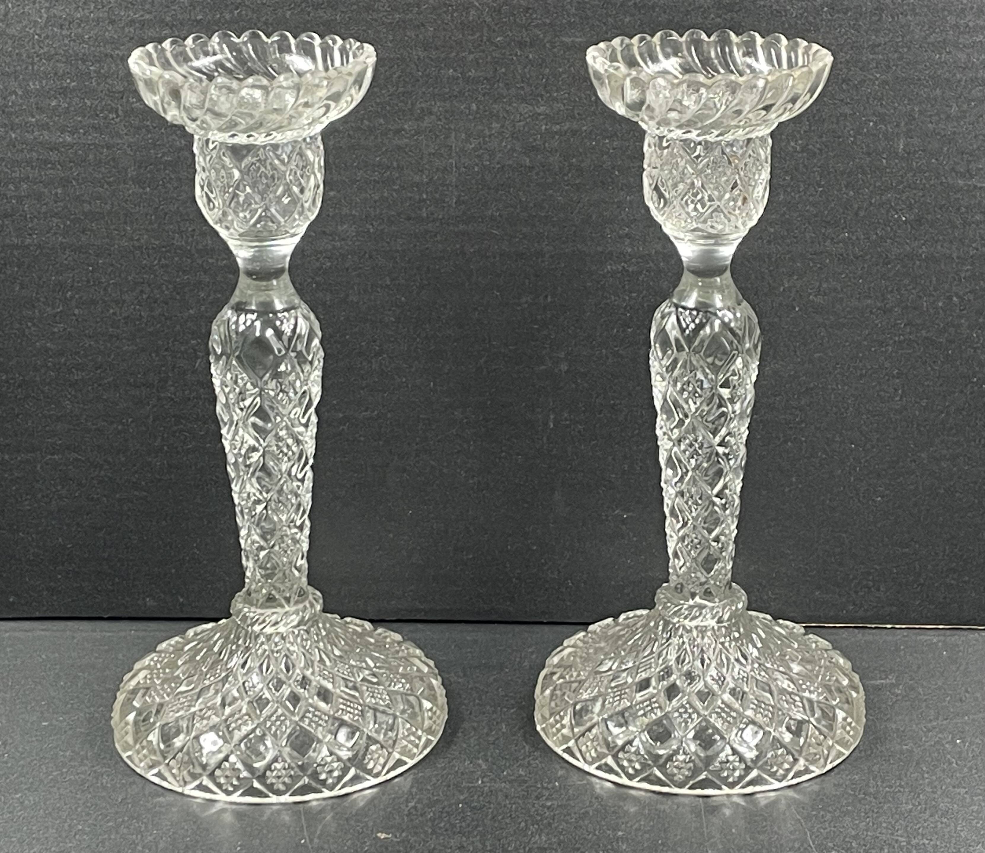 Pair of candle holders in molded glass
