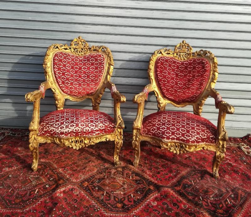 pair of gilded wooden ceremonial chairs