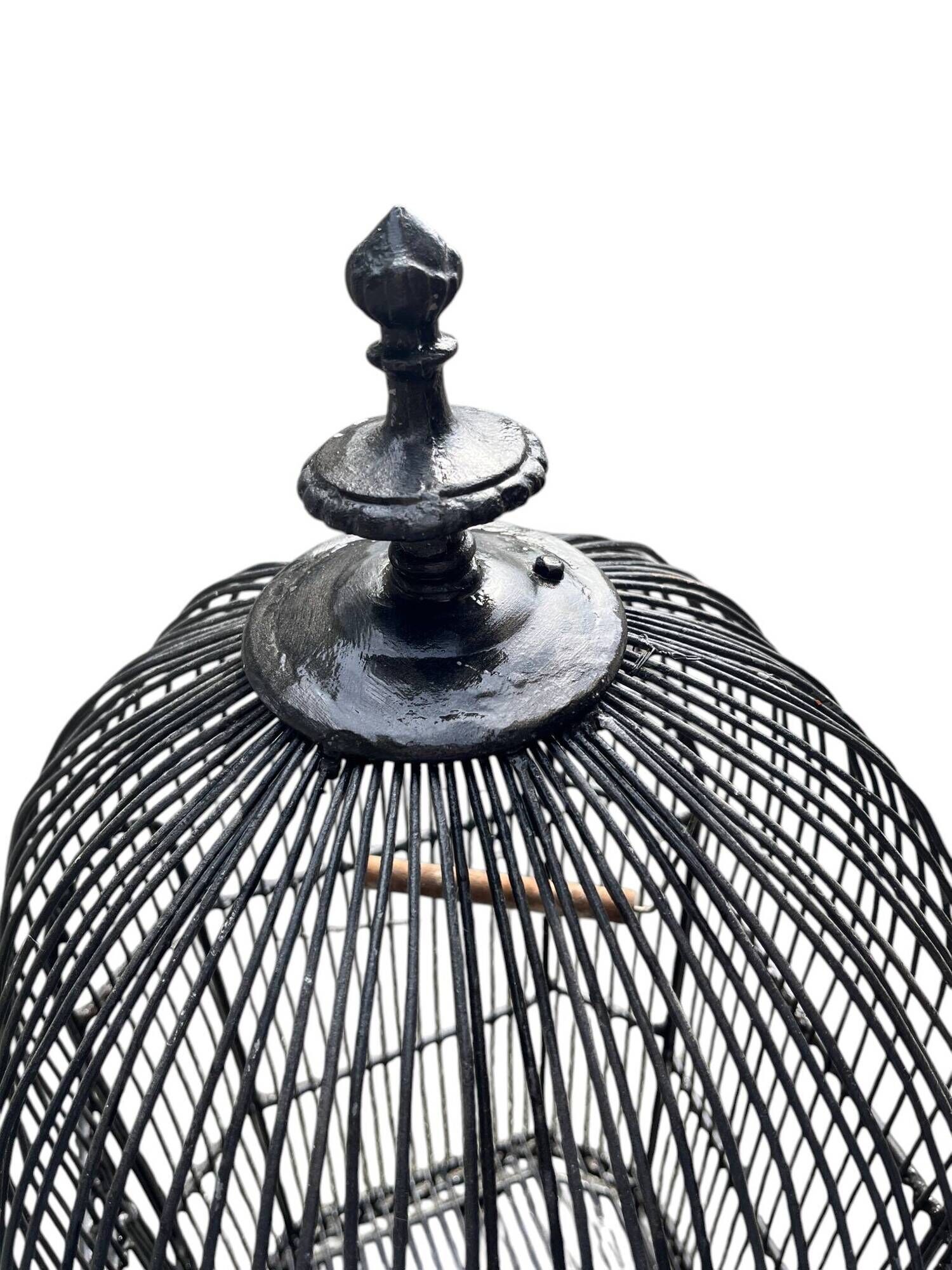 Old black metal birdcage from the early 20th century.