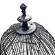 Old black metal birdcage from the early 20th century.