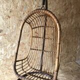 Vintage rattan hanging chair with its stand.