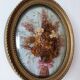 Golden vintage frame with bouquet of dried flowers under globe, wedding bouquet, antique bouquet