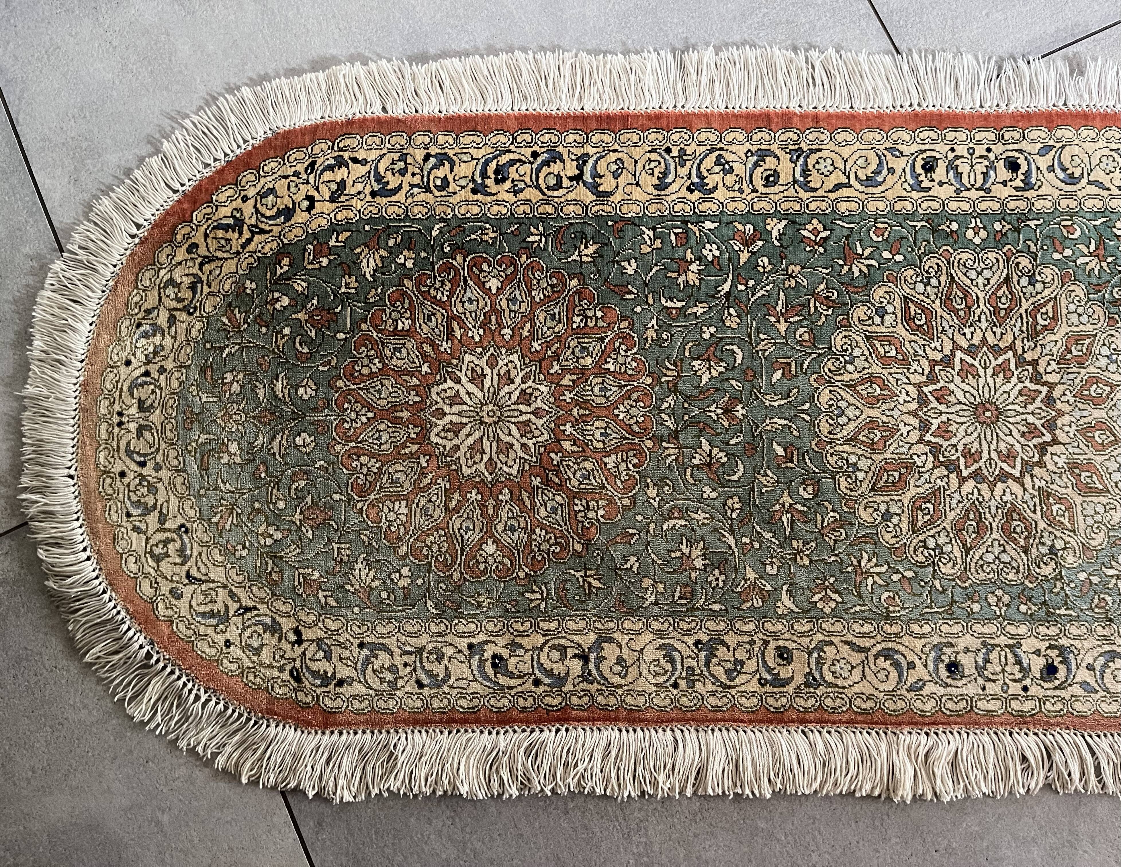 Sino Hereke oval silk rug