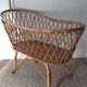 Vintage rattan cradle with its spire