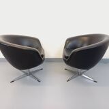 Pair of vintage Scandinavian swivel armchairs in faux leather and chrome.