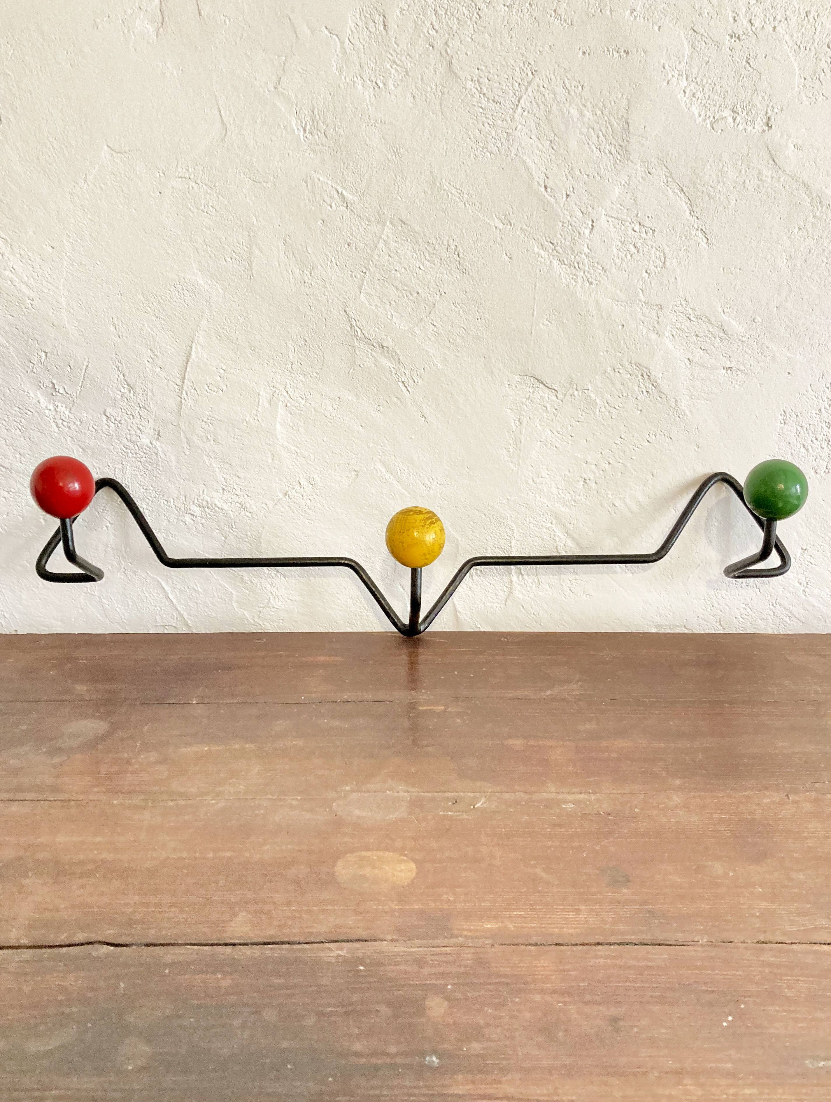 Seventies coat rack/coat hook, green-yellow-red metal and wood