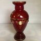 Cameo vase and red cabochons in burgundy glass