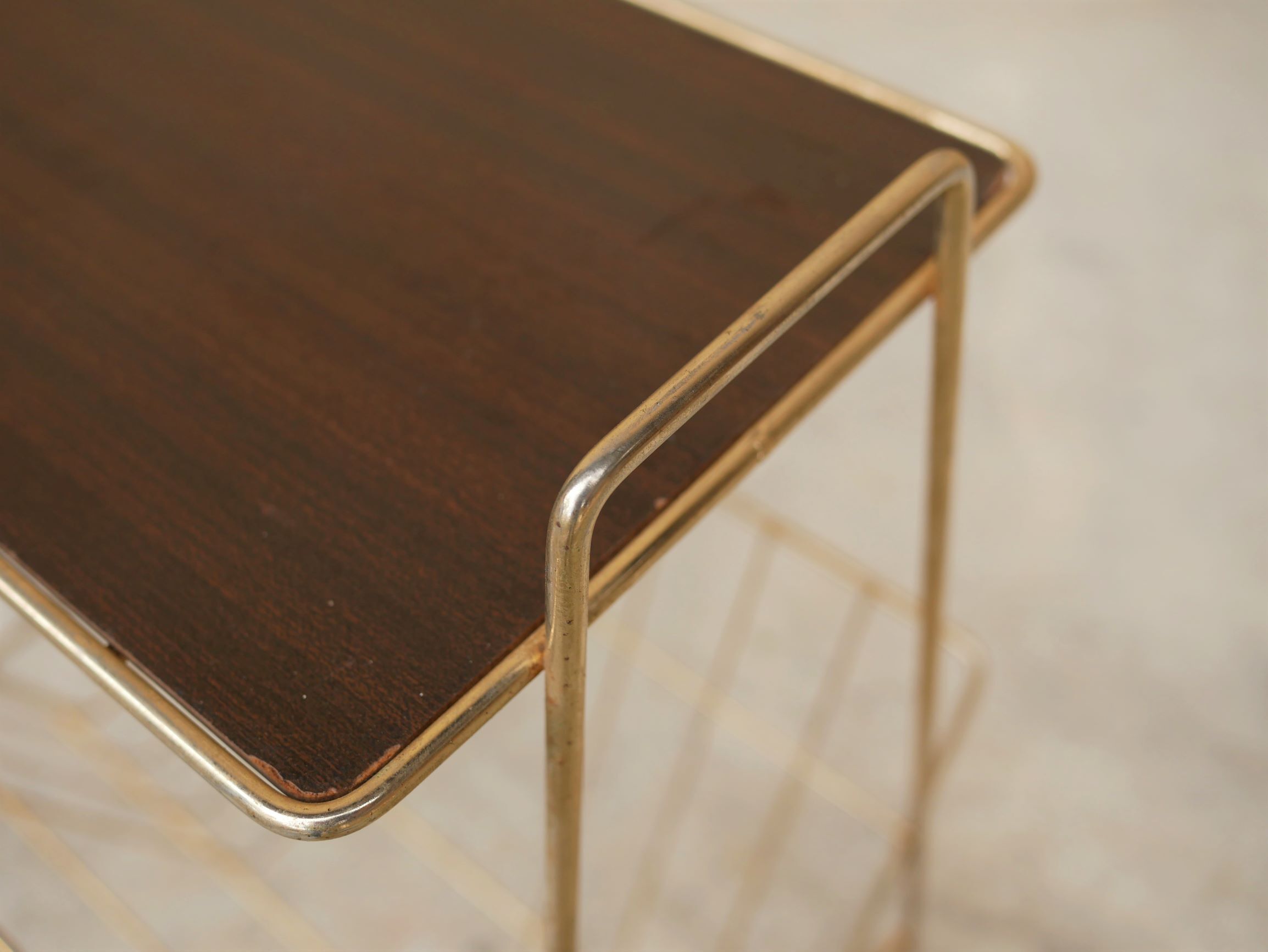 Vintage gold metal magazine rack