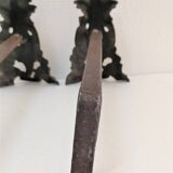 Pair of bronze andirons with black patina, 19th century, female caryatids