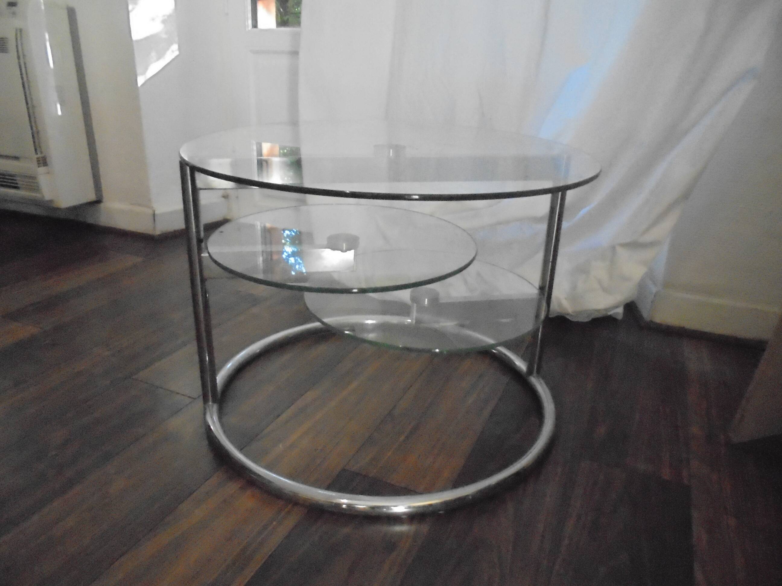 Glass coffee table with swivel tops circa 1980