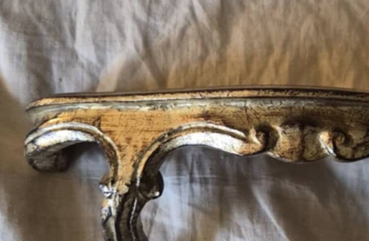 Golden wooden stool in the Louis XV style.