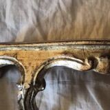 Golden wooden stool in the Louis XV style.