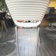 4 Tom Vac chairs designed by Ron Arad with a white round table of 110cm.