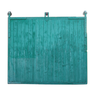 Old wooden door with pulley