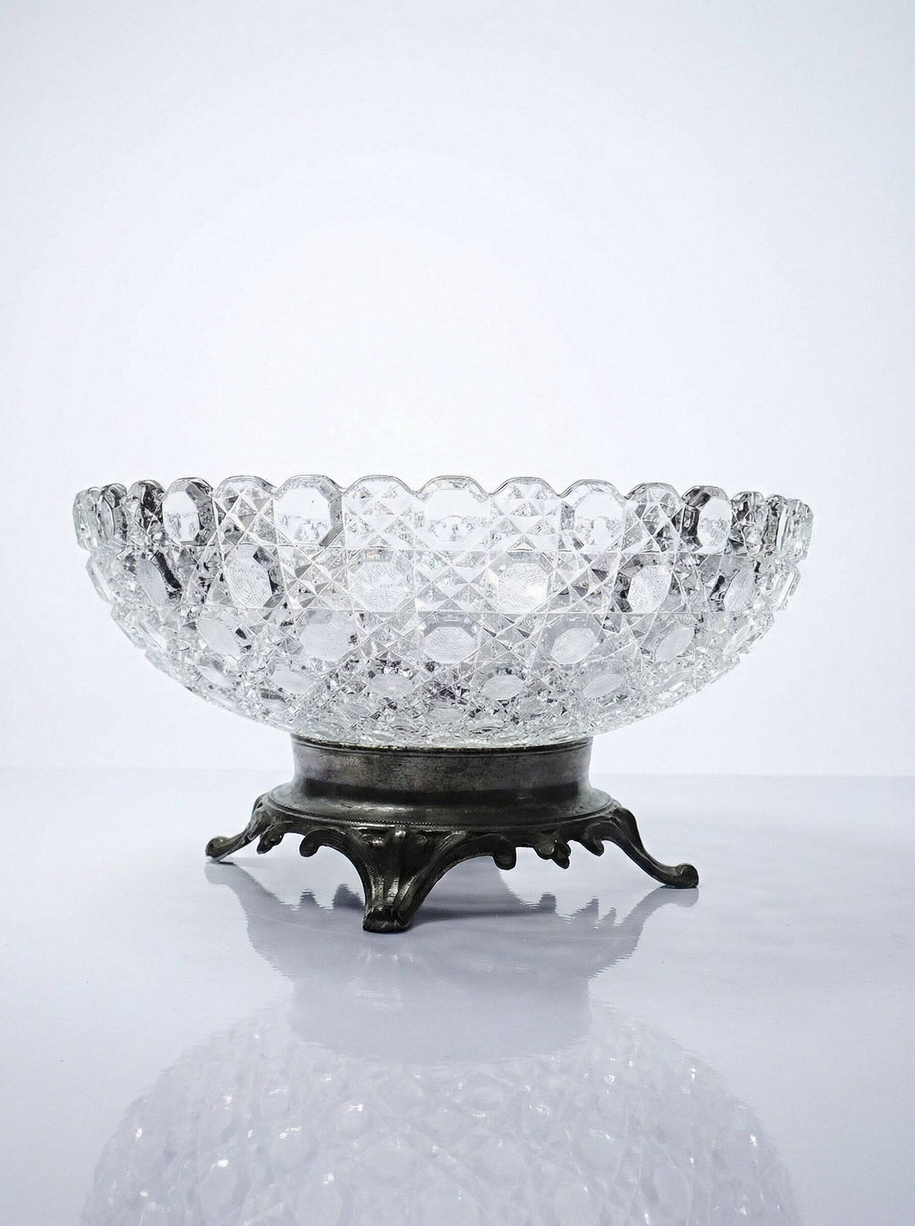 Pressed glass coupe with diamond points, antique from 1920-1950 on a pewter base.