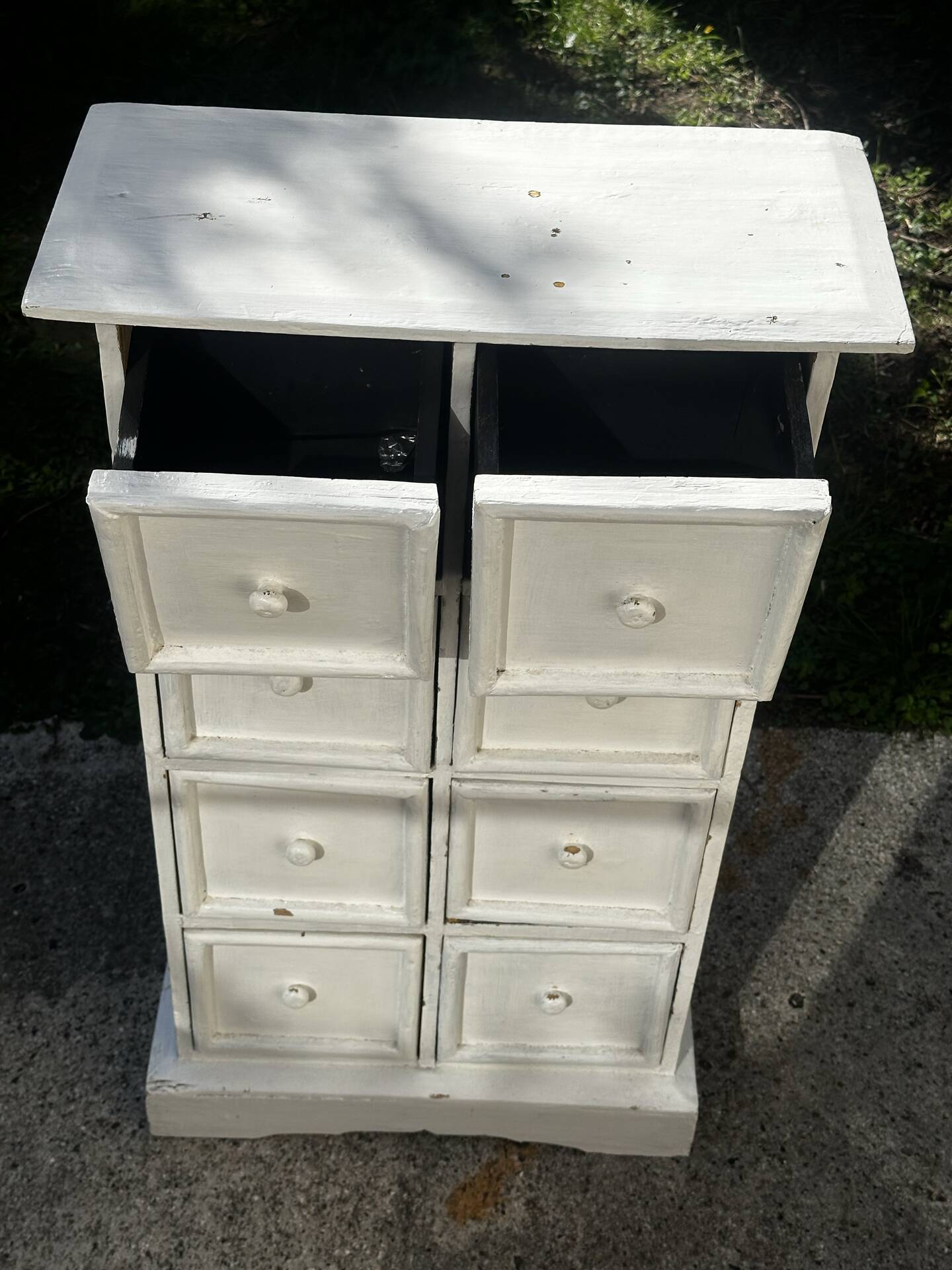 Small antique workshop cabinet with 8 painted wooden drawers.