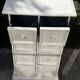 Small antique workshop cabinet with 8 painted wooden drawers.