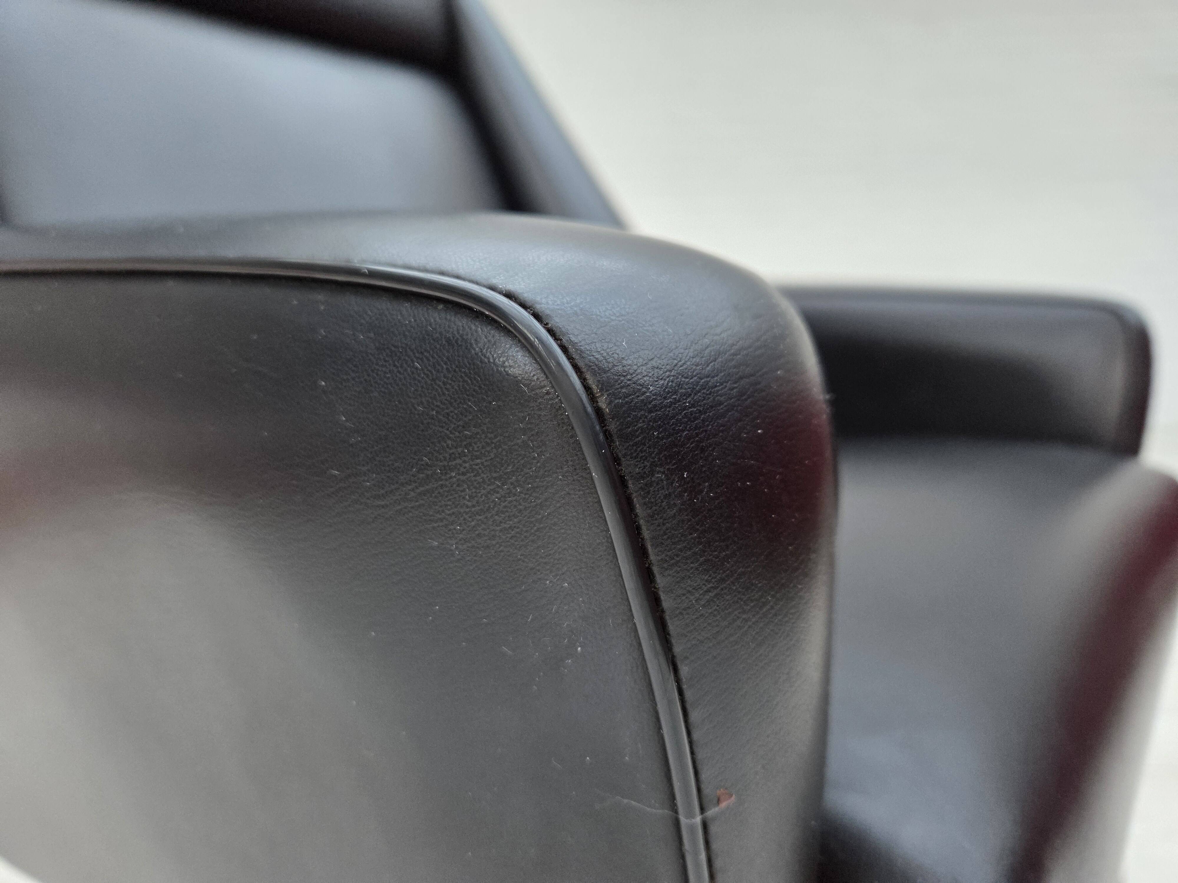 1970s, Danish highback armchair, black artificial leather, teak wood legs.