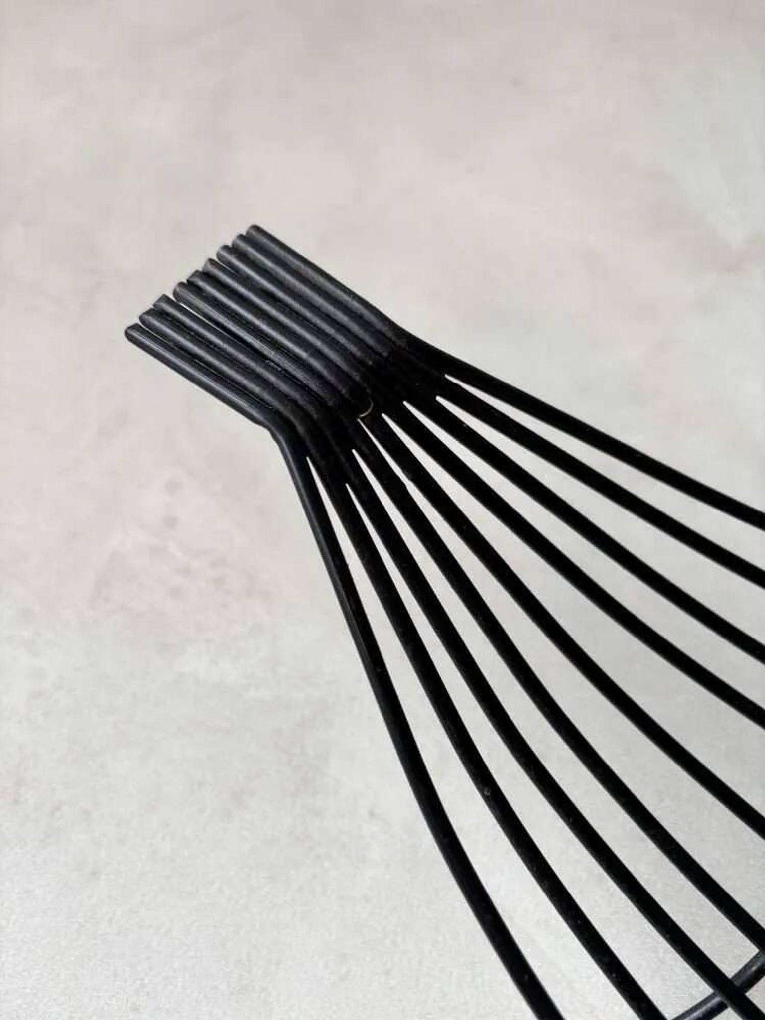 Minimalist black steel wire fruit bowl from the 1950s.