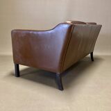 Scandinavian design 2-seater leather sofa.