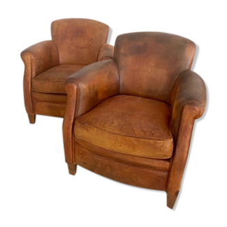 Paire de fauteuils clubs en cuir