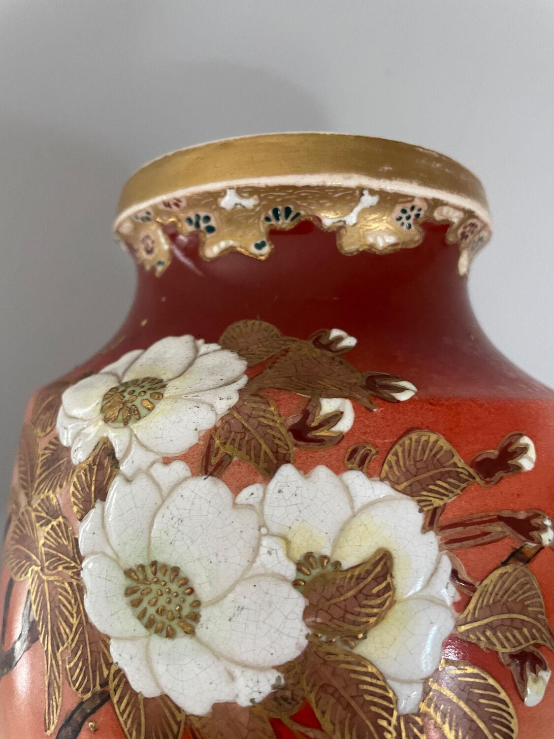 Pair of antique vases with butterfly and flower motif.