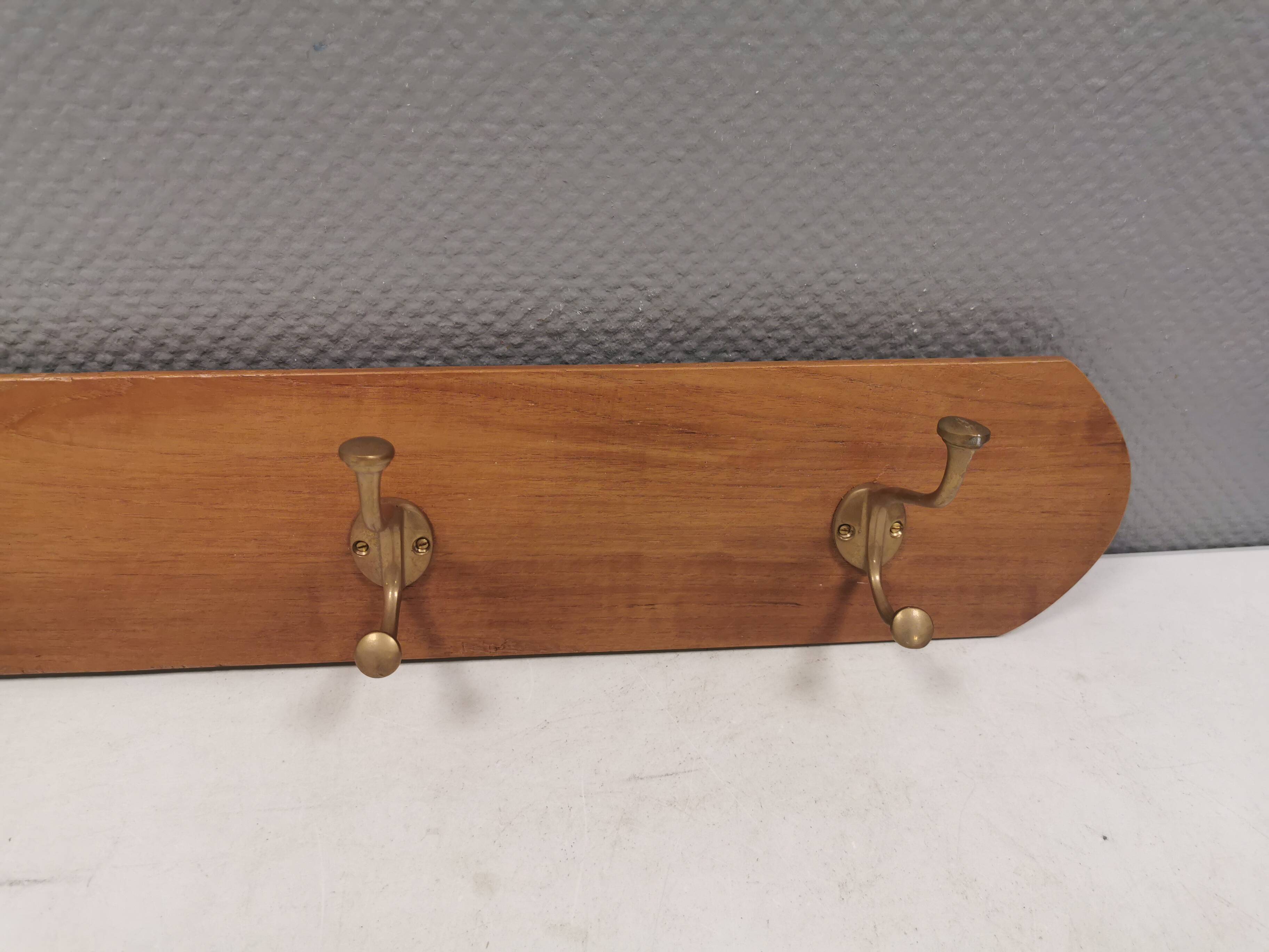 Coat rack in teak and brass. Denmark 1970-80s
