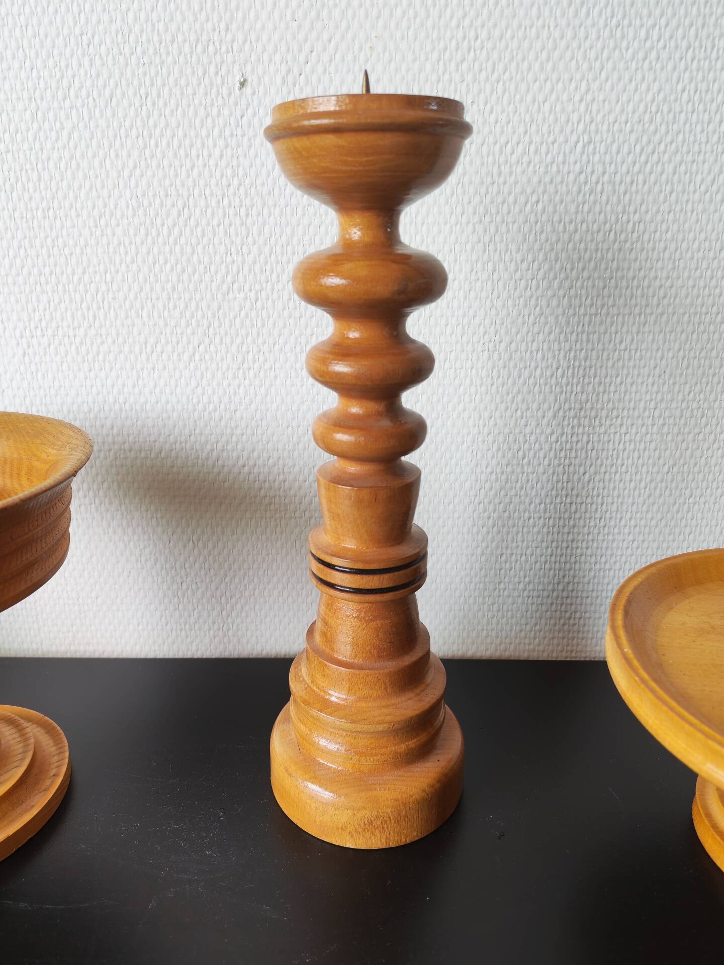 Vintage decor trio: candlestick and light wood bowls in Scandinavian style.