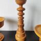Vintage decor trio: candlestick and light wood bowls in Scandinavian style.