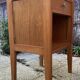 Wooden bedside table, warm tones, vintage, 1950s.