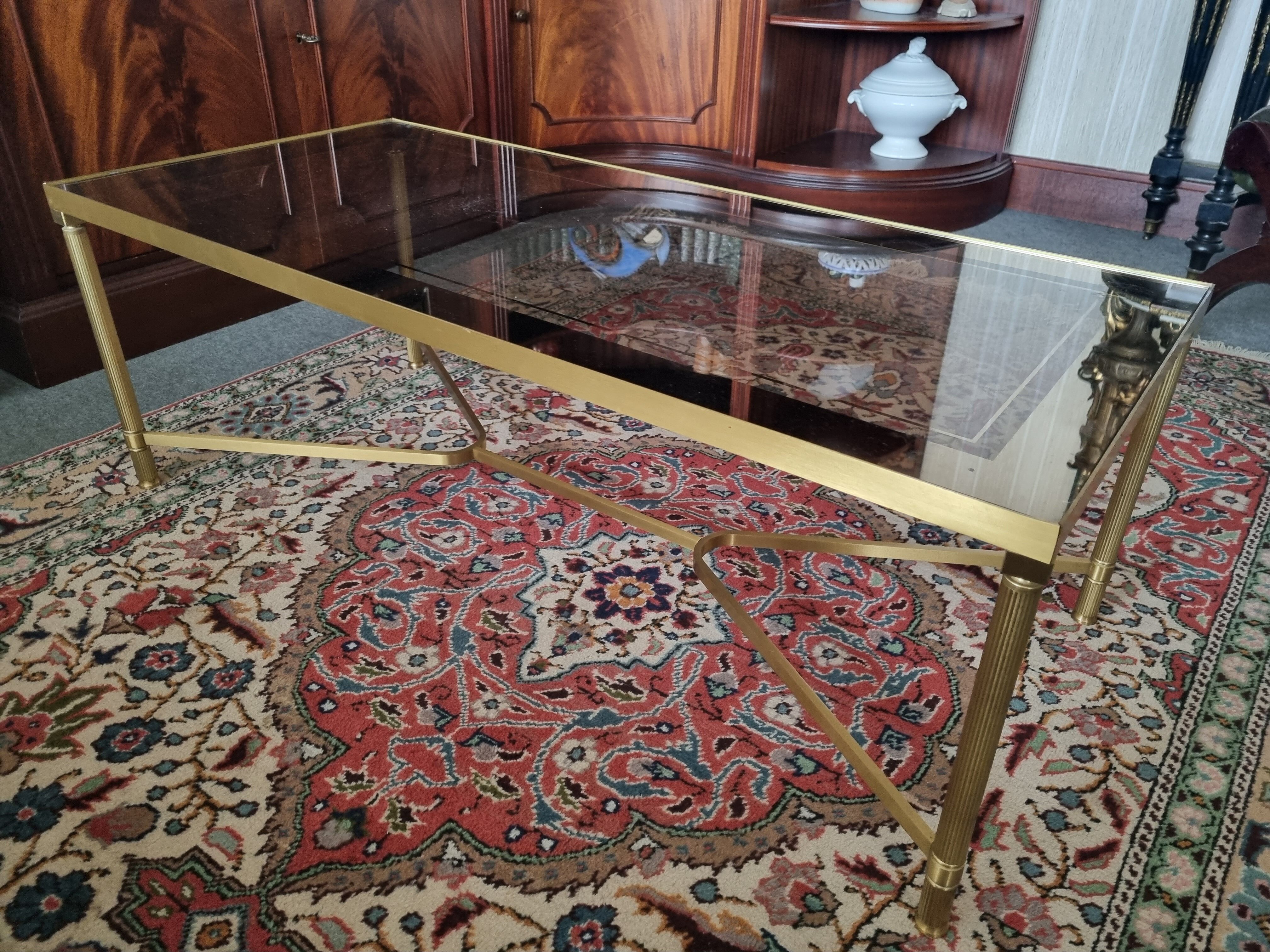 Coffee table in gilded brass and glass top