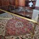 Coffee table in gilded brass and glass top
