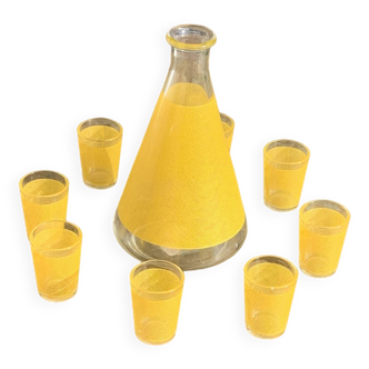 Liqueur service composed of a glass carafe and 8 small yellow screen-printed glasses