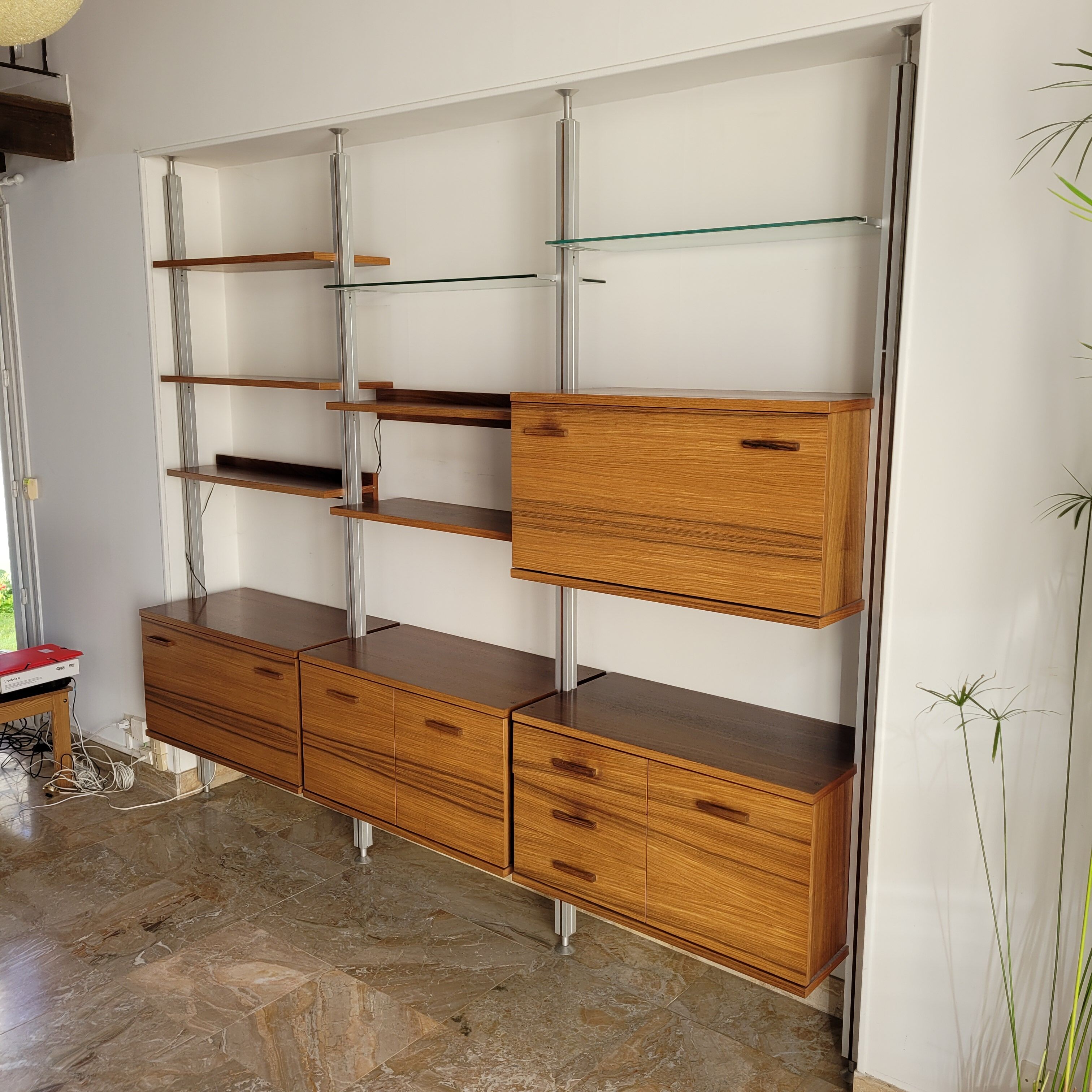 Large Scandinavian wall-mounted wood and aluminum bookcase circa 1960