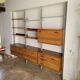 Large Scandinavian wall-mounted wood and aluminum bookcase circa 1960