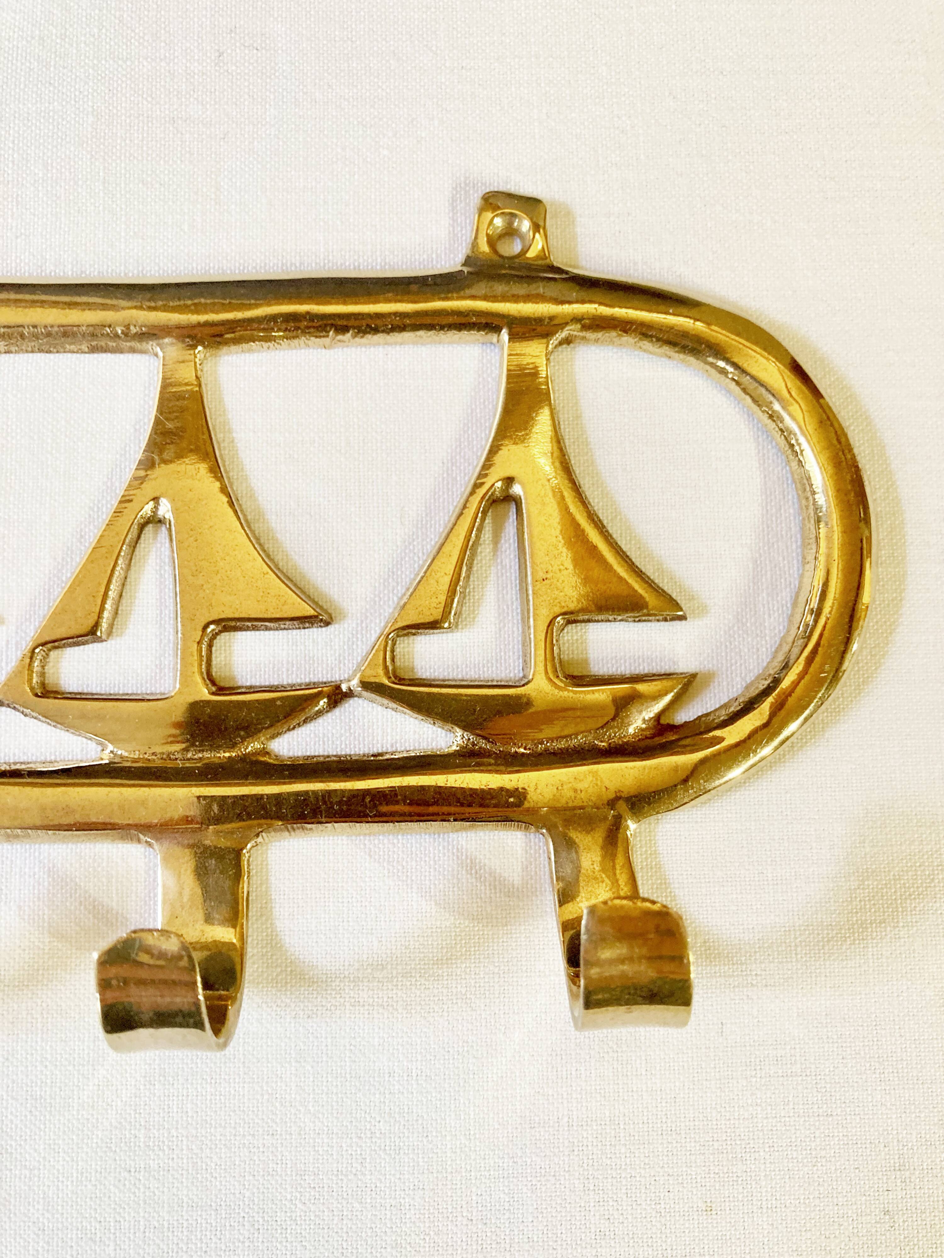 Coat hook in gilded brass, sailboat motifs