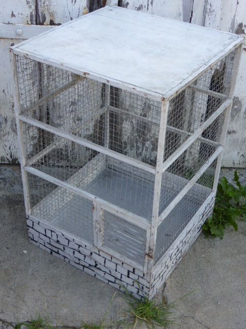 Vintage bird cage, made of wood and chicken wire metal square mesh