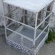 Vintage bird cage, made of wood and chicken wire metal square mesh
