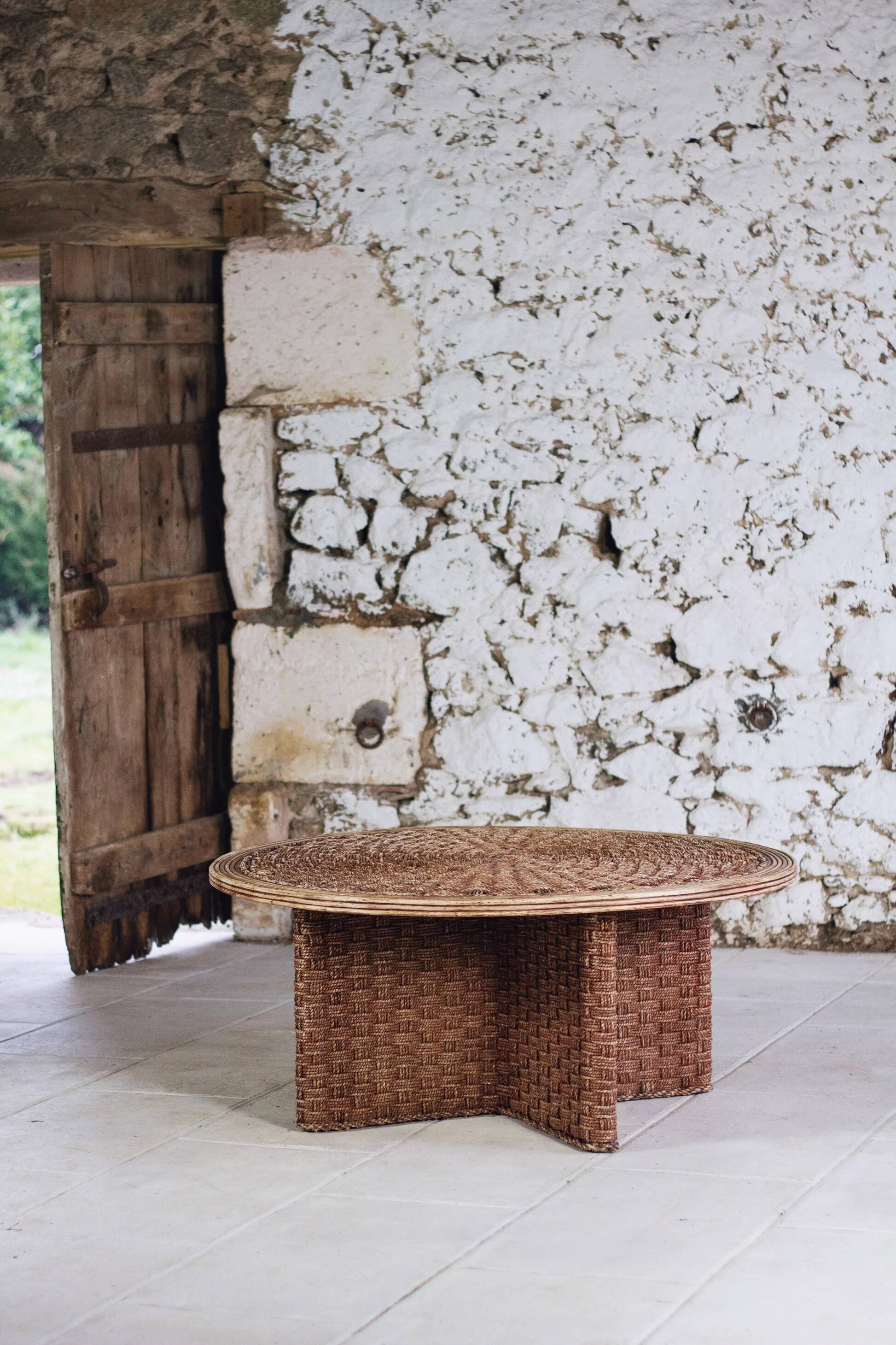 Round coffee table in braided cord and rattan, 1970.