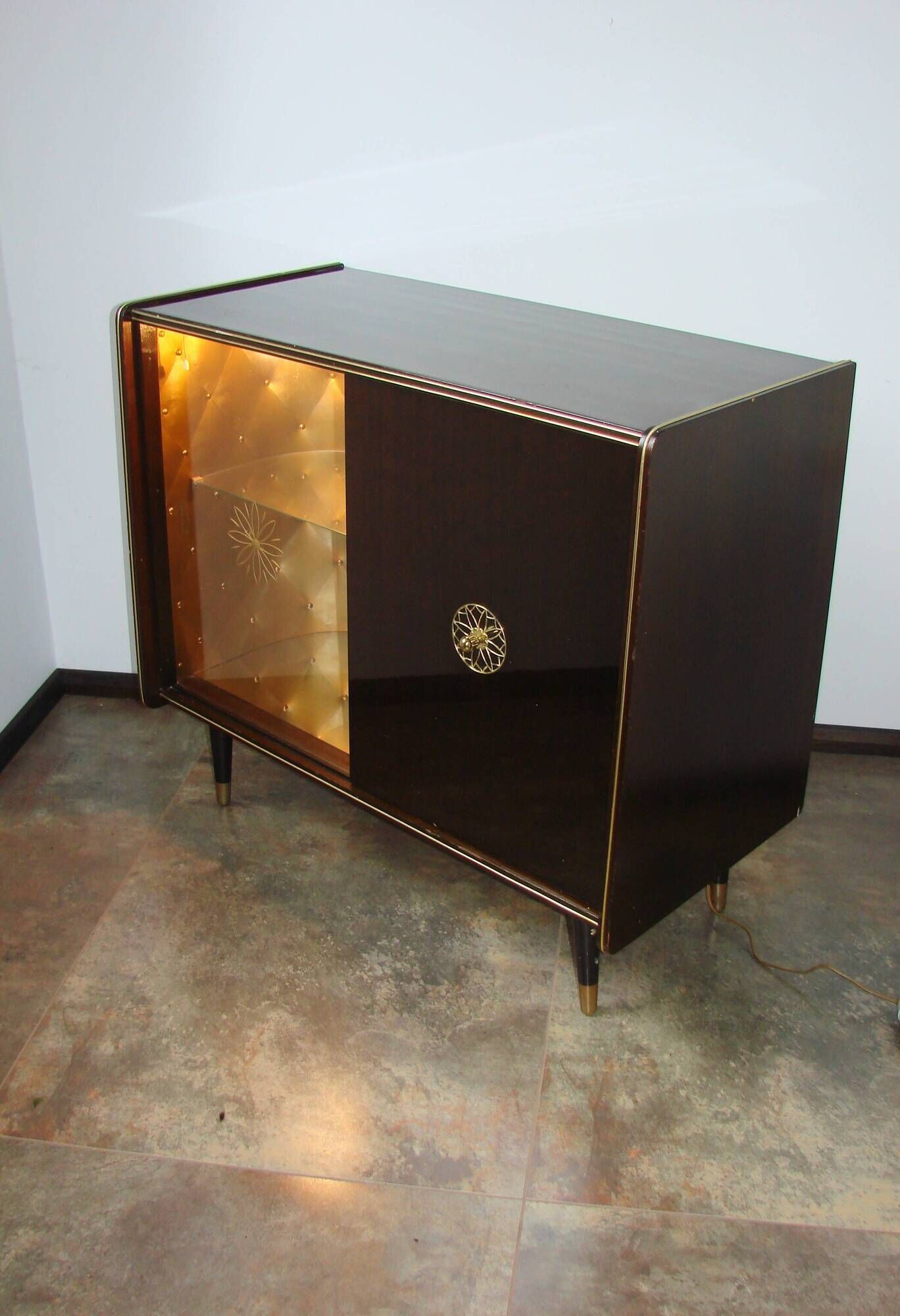 A vintage cabinet with a record player and a bar, 1960s.