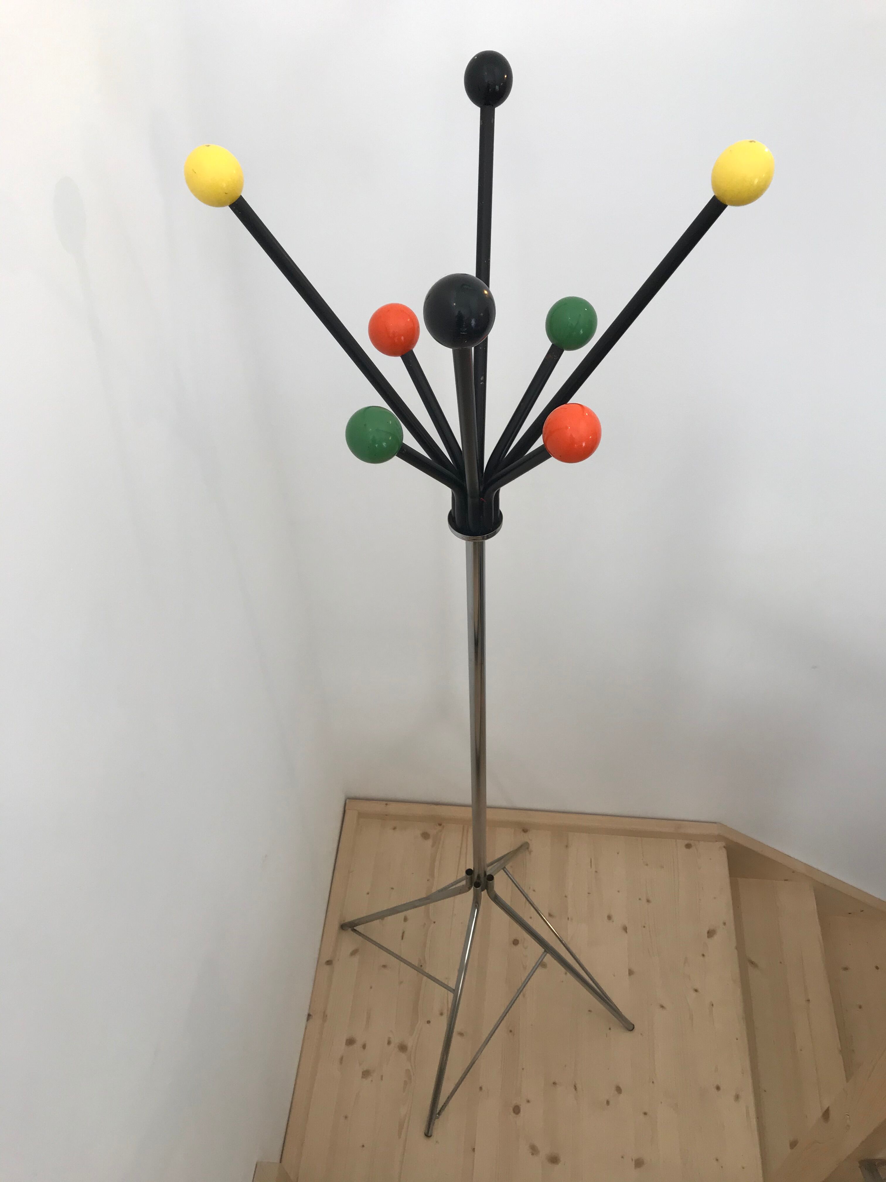 Wearing chrome parrot coat, black and multicolored balls