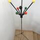 Wearing chrome parrot coat, black and multicolored balls
