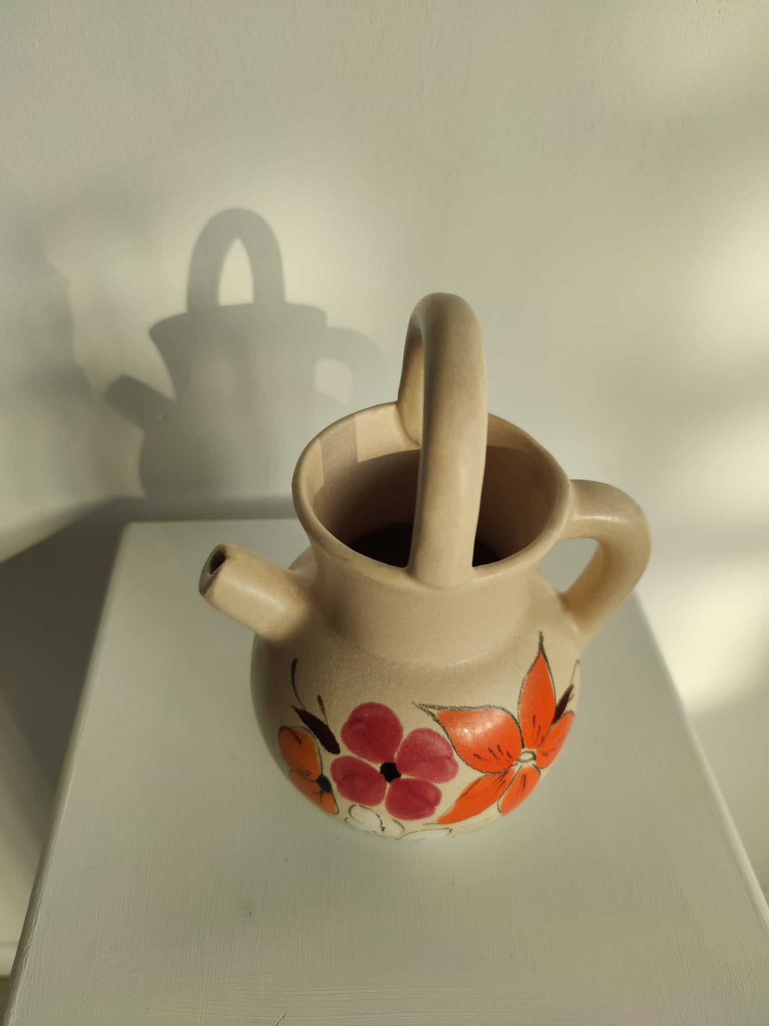 Pitcher ball in sandstone with floral pattern