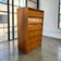 Vintage wooden shoe cabinet / cabinet with drop-down door and chrome accents.