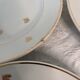 11 plates in antique earthenware decorated with golden leaves and golden border